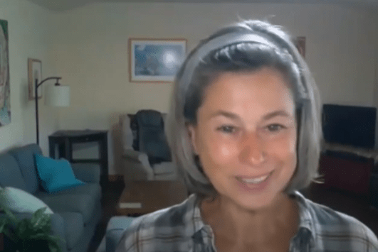 Smiling woman on a video call at home
