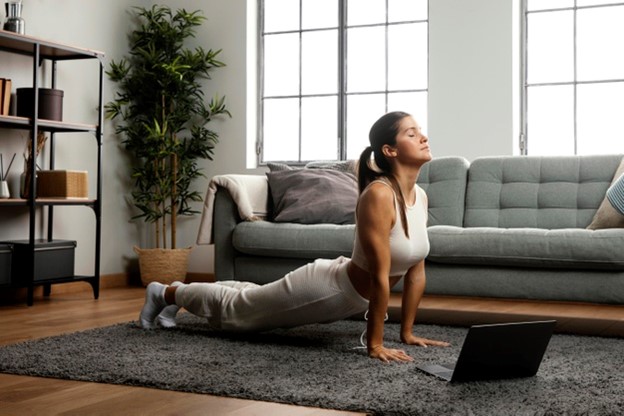 a woman deep breathing while stretching