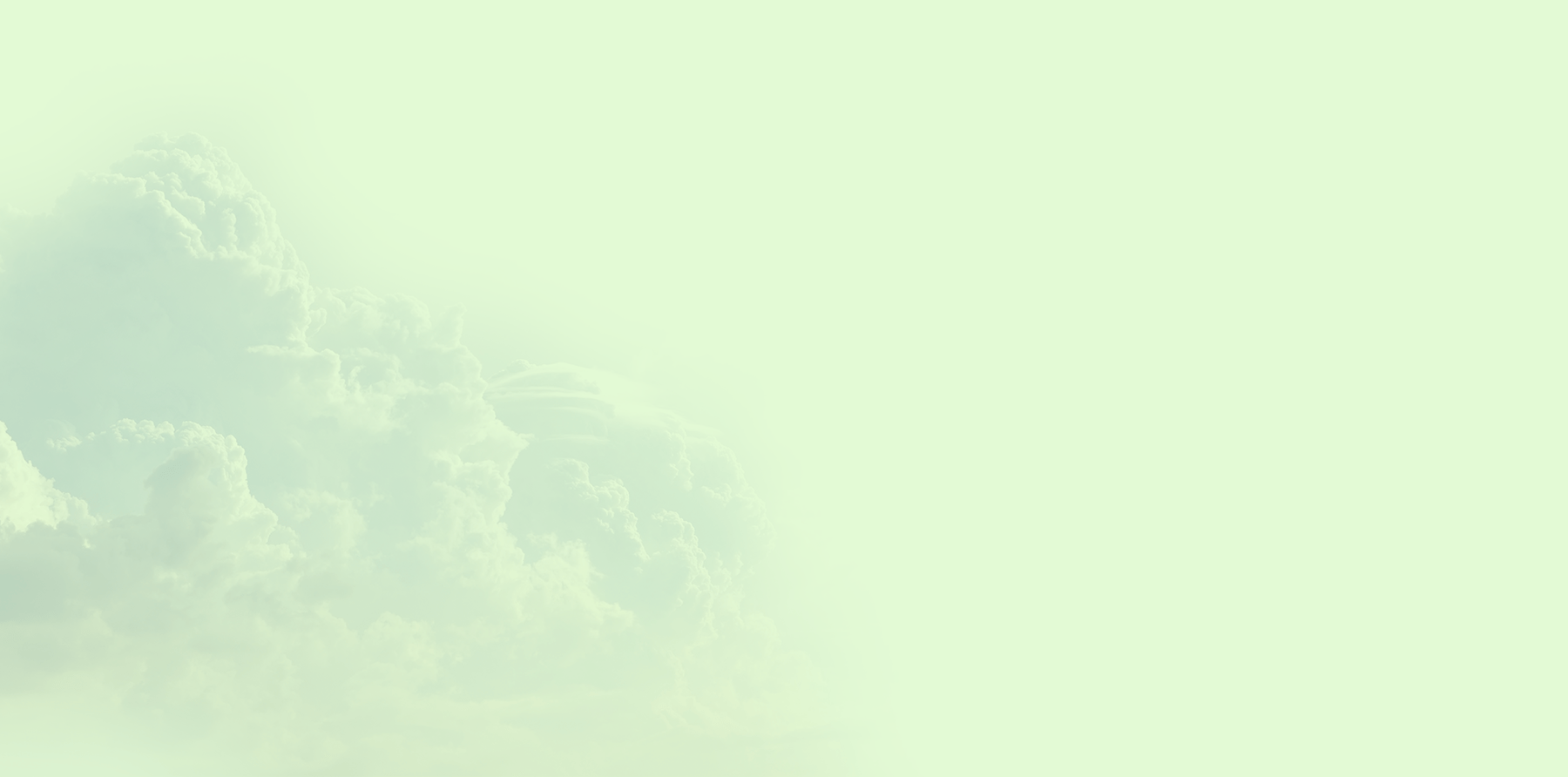Pale mint sky with soft fluffy clouds