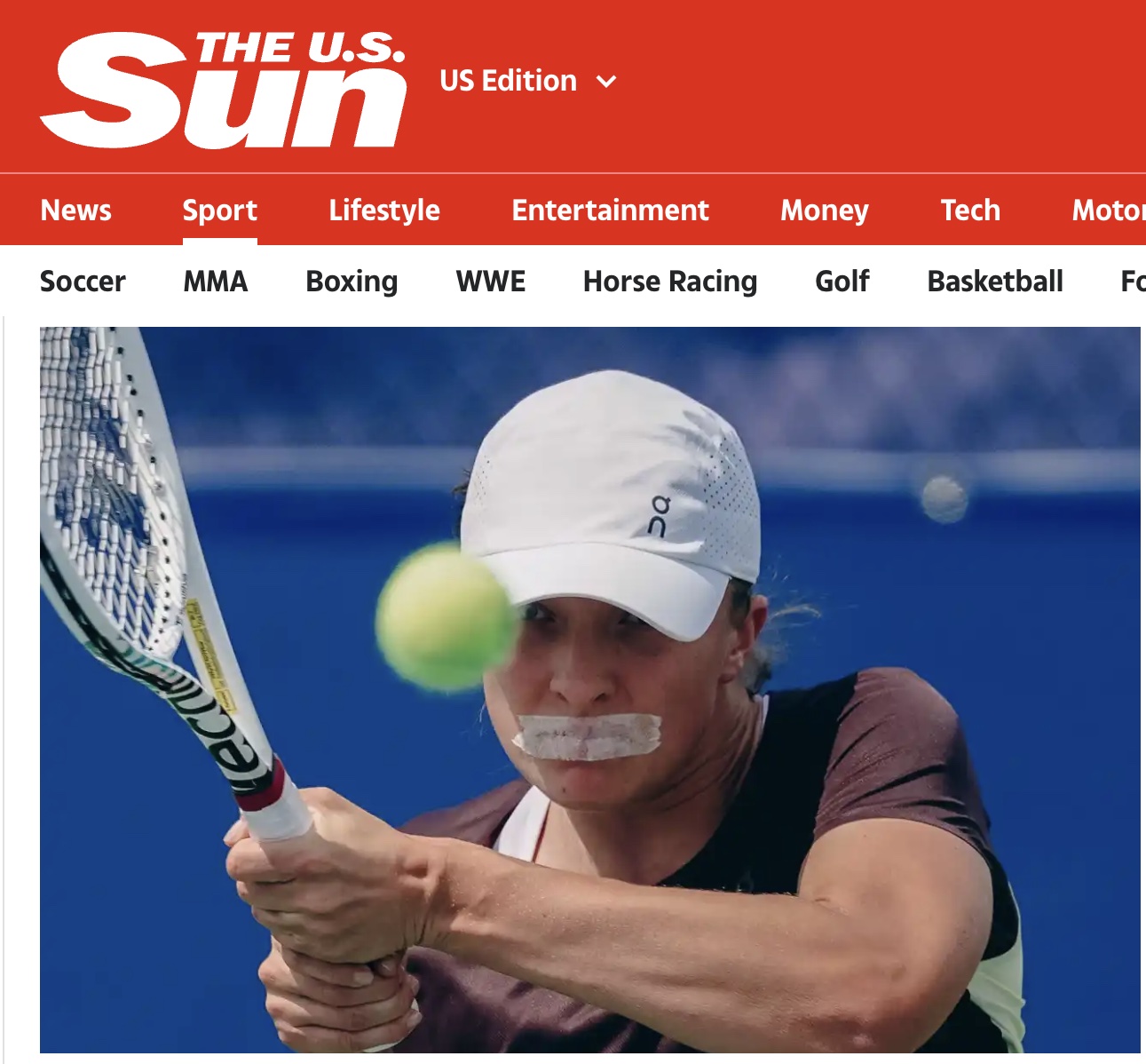 Tennis player with taped mouth hits ball